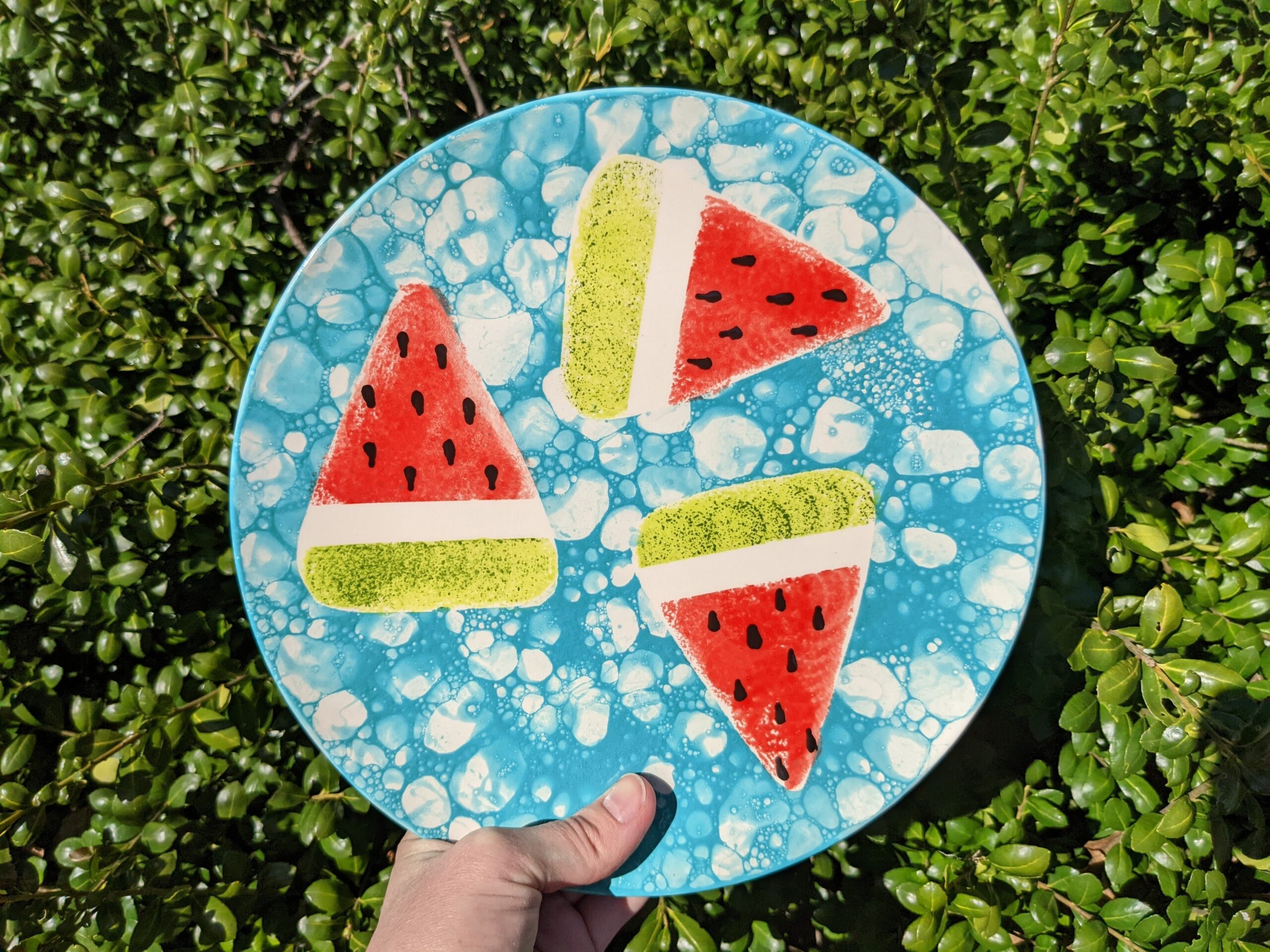 A paper plate with watermelon slices on it